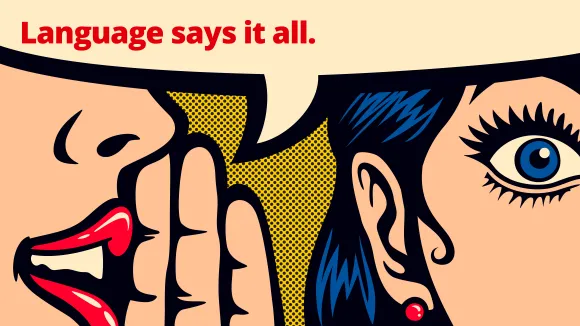 A cartoon image of someone whispering 'Language says it all' into the ear of another person.