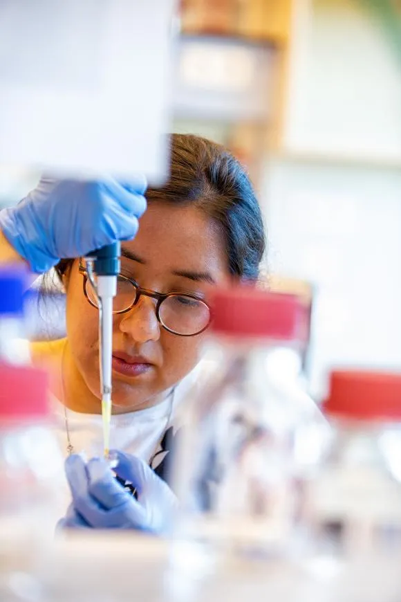 A woman doing research into molecular biology