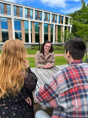 Students sitting at a table chatting
