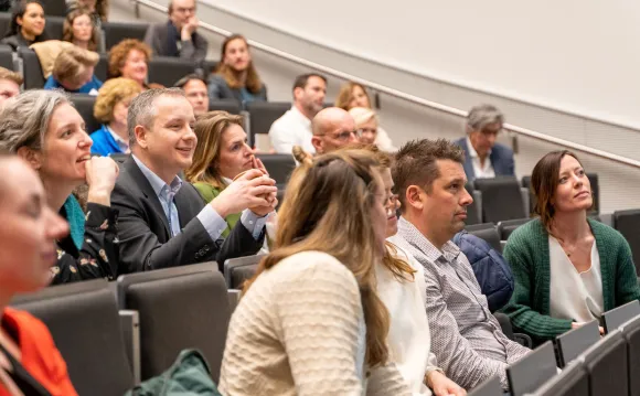 People listening in lecture hall