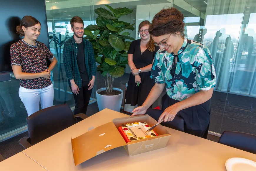 PASSIM Team cutting the cake in celebration of the Radboud Team Science Award