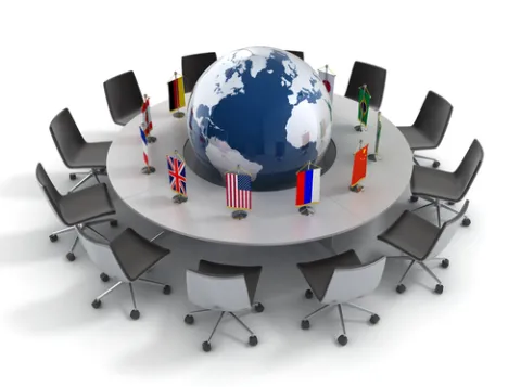 Round table with a globe in the middle.
