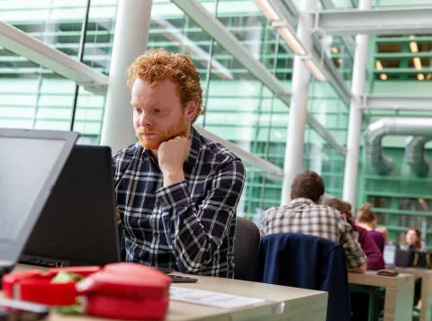 A student sitting in the Library of Science