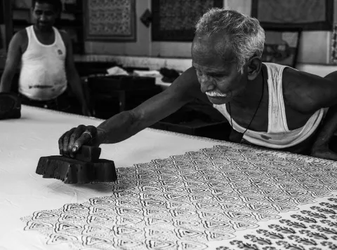 Man stamping on white surface