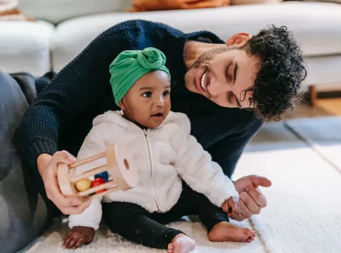 Father and baby playing