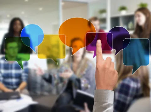 People talking, indicated by speech bubbles