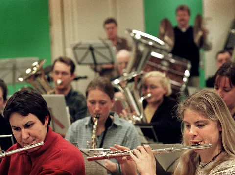 Students play their wind instruments in the orchestra band QHarmony