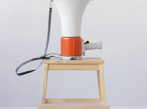 Megaphone on a wooden stool