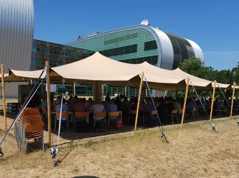 Tent outside in the sun for User Meeting Gathering