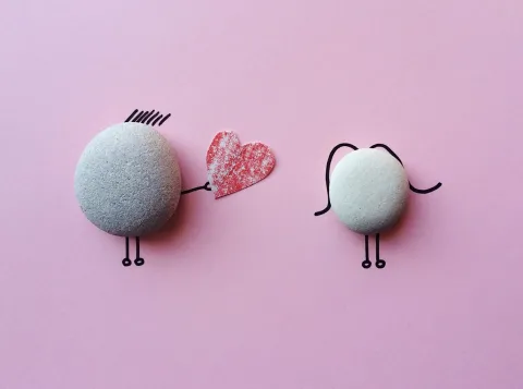 two stones drawn like people 