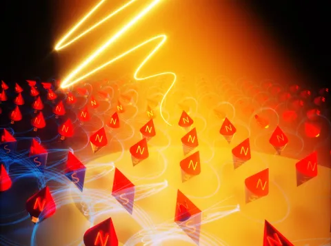 Figure: The ultrashort laser pulse triggers rotation of elementary magnets, “spins” in a magnetic material, launching a “magnon” wave, which can carry energy and information.