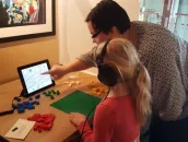 A child watching an instructional video about (foreign) language