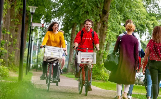 radboud university international students riding bikes in nijmegen