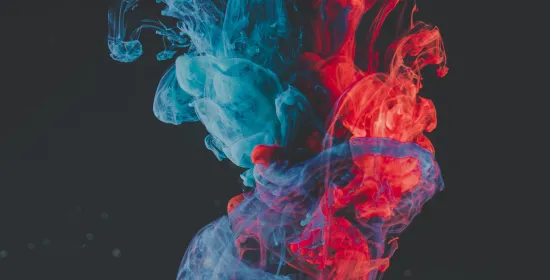 Abstract image of blue and red smoke coming together