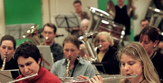 Students play their wind instruments in the orchestra band QHarmony