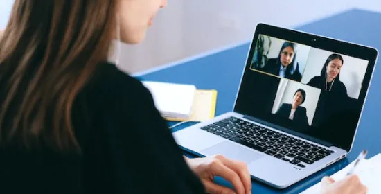 Woman on a conference call on her laptop