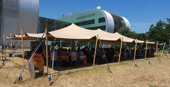 Tent outside in the sun for User Meeting Gathering