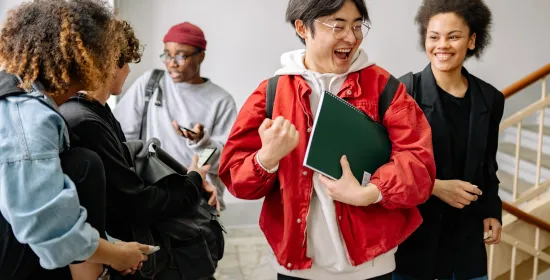 Group of Students Talking at a Staircase
