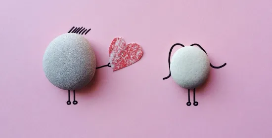 two stones drawn like people 
