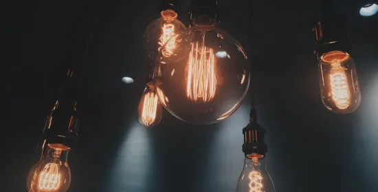 Six lightbulbs against a dark background
