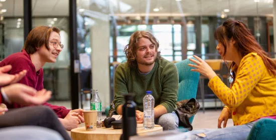 Students socializing in the Refter on campus