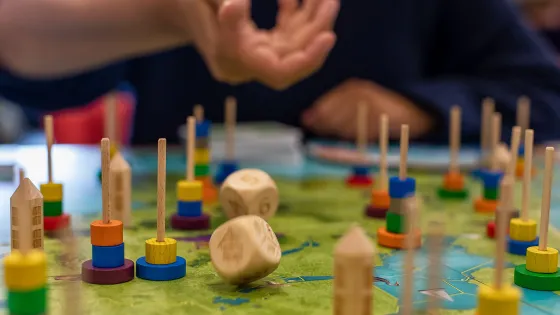 2 wooden dices are thrown on the boardgames