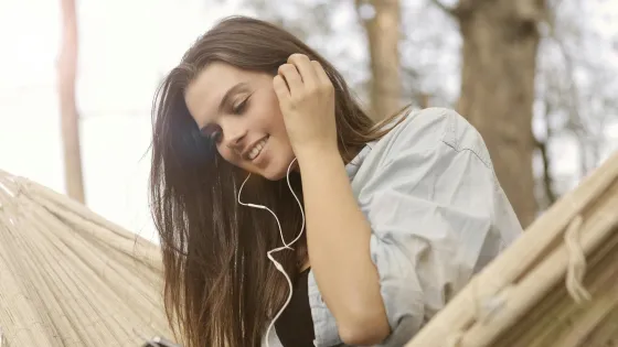 Woman with phone in hammock