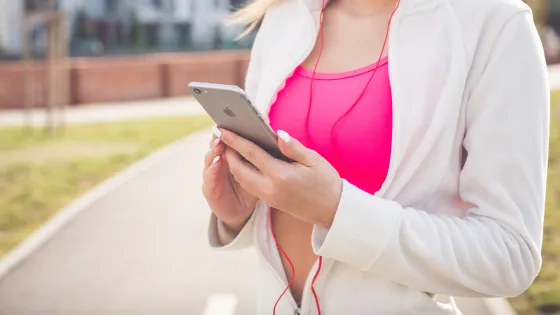 person holding phone while exercising via pxhere